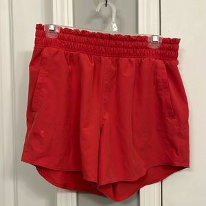 Under Armour running shorts. High waisted. Pockets.